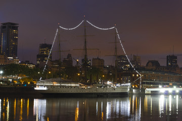 A sailboat moored. Puerto Madero is a district at Buenos Aires, Argentina, occupying a portion of the R&iacute;o de la Plata riverbank and representing the latest architectural trends in Buenos Aires