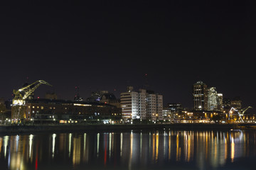 Fototapeta na wymiar Buenos Aires, Argentina. Puerto Madero by night. it's a district at Buenos Aires, occupying a portion of the Río de la Plata riverbank and representing the latest architectural trends in Buenos Aires