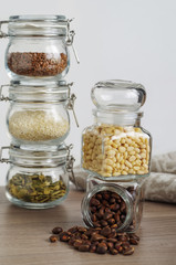 Pine nuts are peeled and unpeeled together scattered from the jars