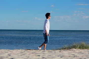 Young man relaxing on the beach