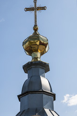 Fototapeta na wymiar Domes and crosses of Orthodox temple 