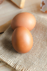 Close up shot of  egg on hemp sackcloth with bread and bakery background