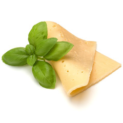 cheese slice and basil herb leaves isolated on white background cutout