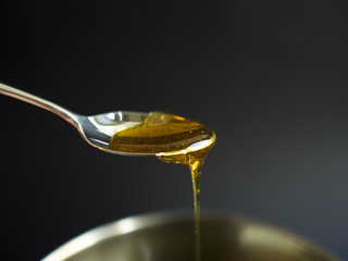 Syrup dripping from a spoon
