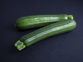 Zucchini isolated on black