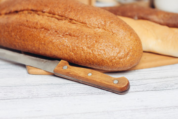 loaf on the board, knife