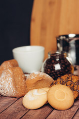 oatmeal cookies flour products on the table, coffee in a jar