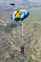 Tandem jump. The instructor and the student in freefall.