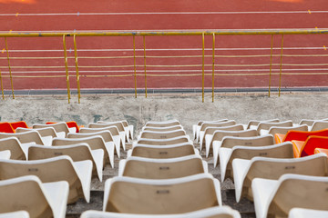 Obraz premium Empty plastic seats at stadium