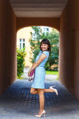 Beautiful young woman posing in the archway