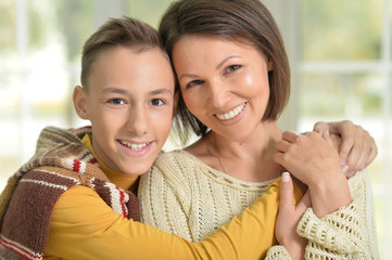 young mother and son smiling 