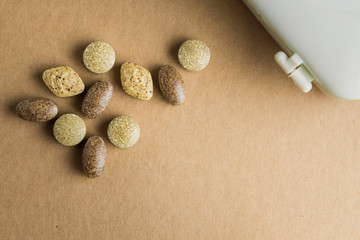 Closse up of herb Medicine with slice of drug box on brown paper board