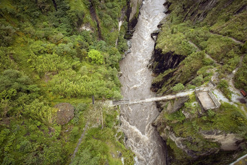 Dangerous bridge crossing the  upper Rio Pastaza, Ecuador, on the eastern slopes of the Andes