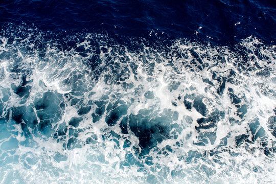 Blue sea waves with a lot of sea foam © zoranlino