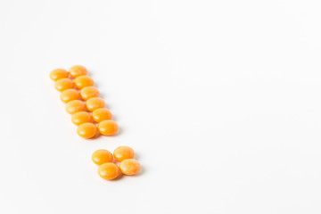 exclamation mark shape made of pills