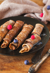 Rolled pancake with chocolate sauce