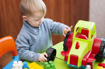 a child playing with a broken