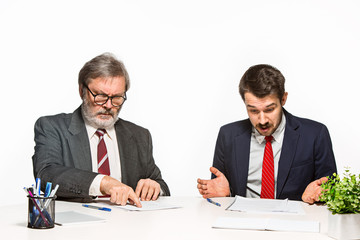 Fototapeta premium The two colleagues working together at office on white background.