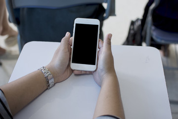 Hand holding phone black clipping inside and touching.