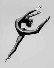 Young beautiful dancer posing in studio