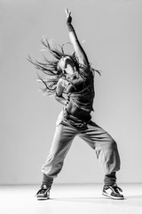 Young beautiful dancer posing in studio