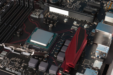 Modern, new, gaming motherboard with installed CPU processor.