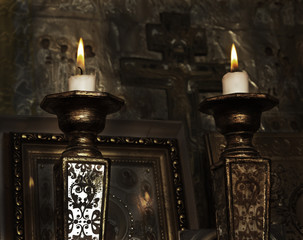 Lighting candles in a church, vintage style