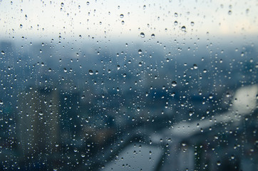bokeh blur rain drop on glass rainy season