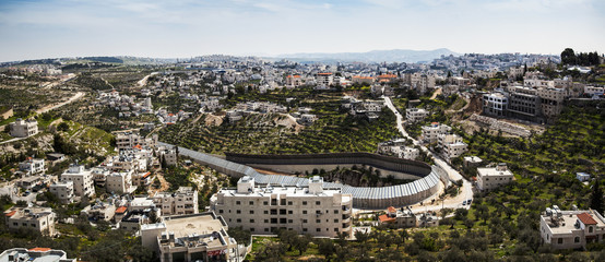 Circular protection wall surrounding a tunnel that goes from Israel under Palestine and comes out to another part of Israel; Israel