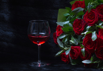 glass of wine and a bouquet of roses on a black background, black fur, Women's Day on 8 March