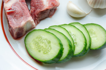 Crude meat, garlic and cucumber