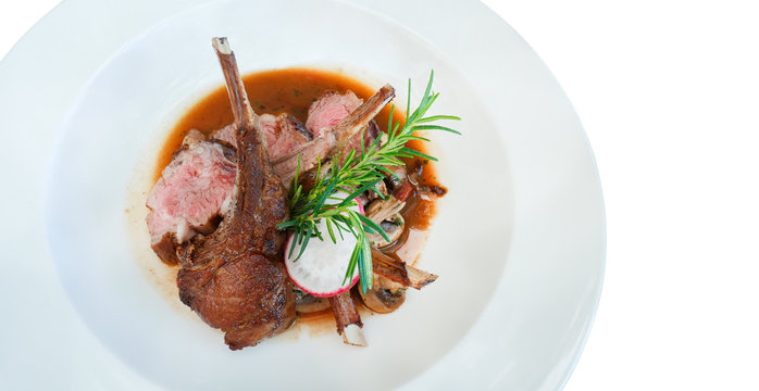 Lamb steak in ceramic dish isolated on white background