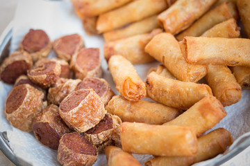 Deep fried spring rolls and deep fried chicken rolls