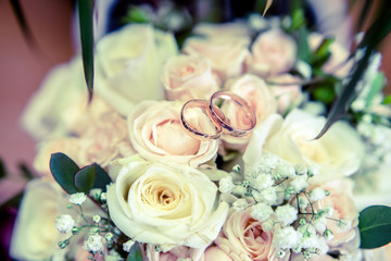 Engagement rings are on the wedding bukete.Soft focus 