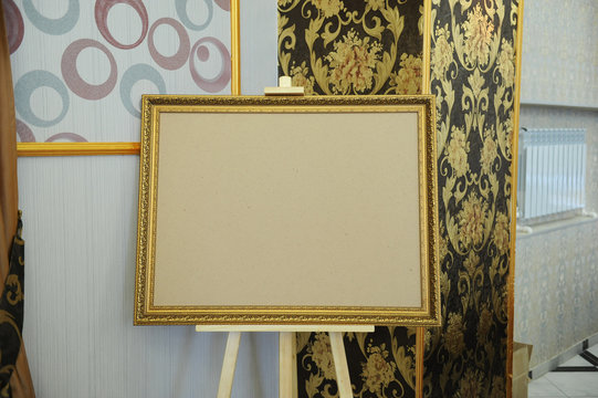 Easel with frame for decoration of party. Free space for text or design