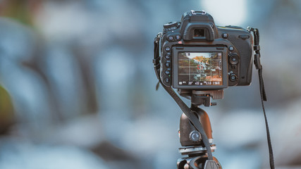 Setting the digital screen camera on a tripod.