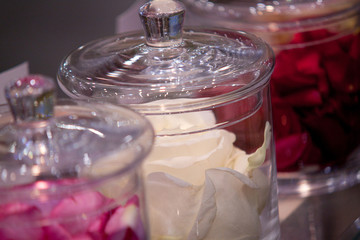 Rose petals in glass jars
