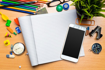 School supplies on wooden background