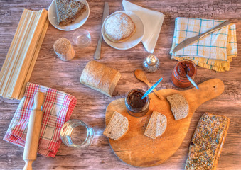 Breakfast with bread,marmalade and desserts.Image taken from above