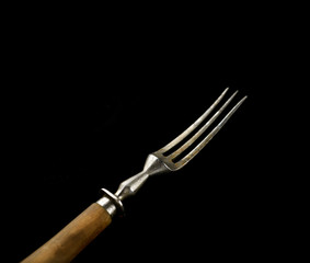 Vintage  fork on a black background