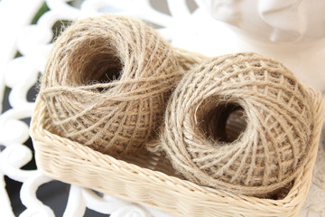Natural hemp rope on basket, selective focus