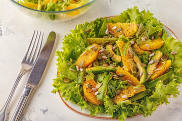 Avocado orange salad with  pumpkin  and sunflower seeds.