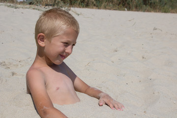 Boy in the sand on the beach