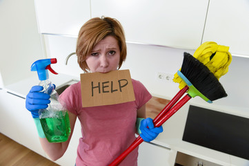 woman at home kitchen in gloves with cleaning broom and mop asking for help