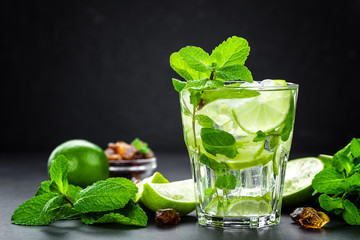 Mojito Cubano or caipirinha cocktail, iced drink with lime and mint