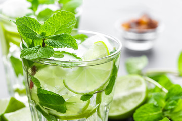 Mojito Cubano or caipirinha cocktail, iced drink with lime and mint
