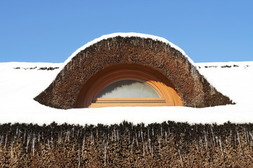 Reed roof in winter time - 137493159
