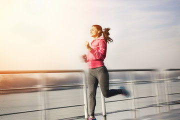 Young woman jogging motion blur