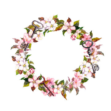 Vintage floral wreath with spring flowers, feathers, keys. Watercolor round border