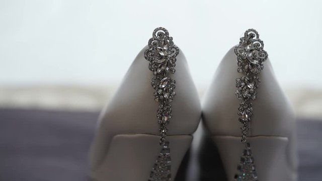 Earrings and white shoes shot